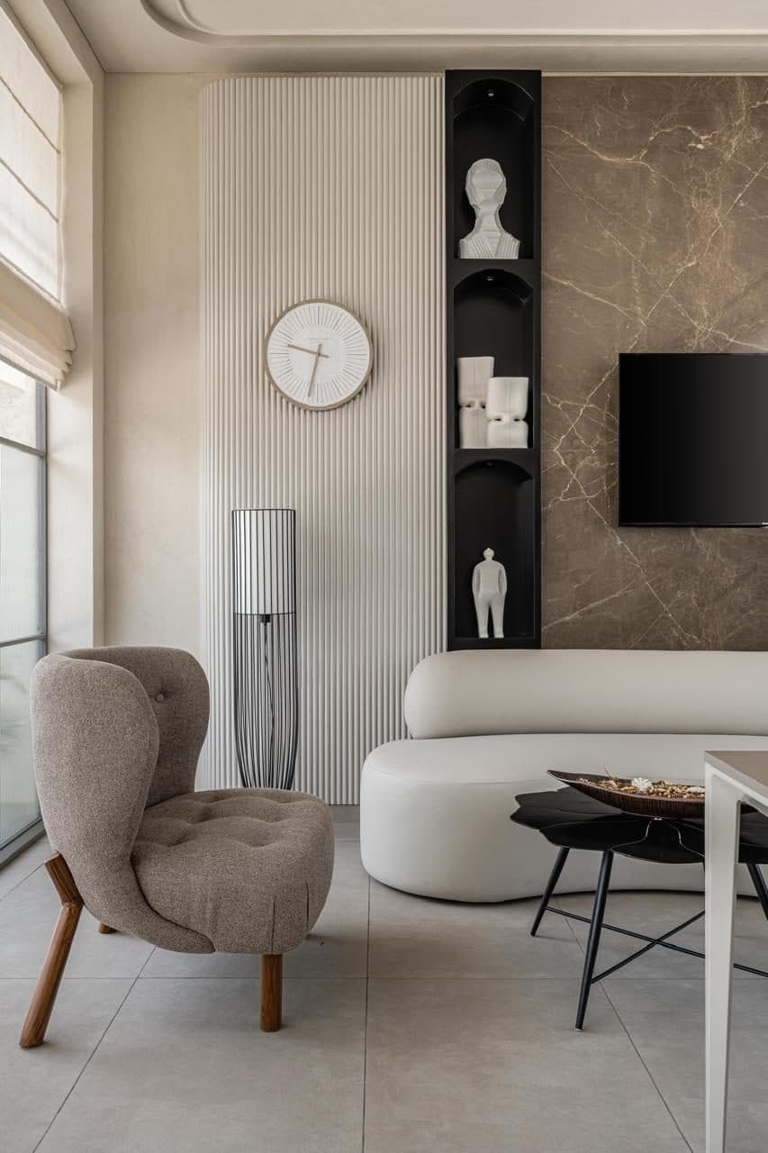 A Residential Flat — The living room — soft forms against a warm shell